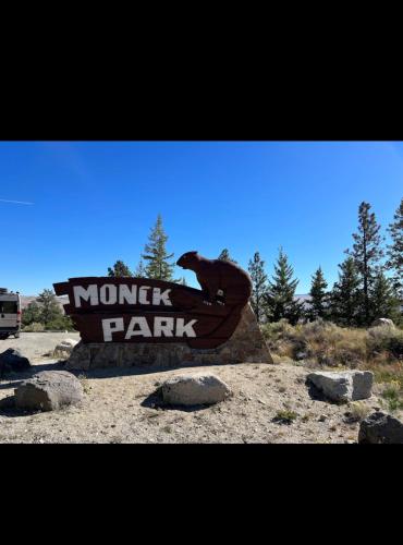 a sign for a monkey farm in the desert at Delta Guest House Merritt in Merritt