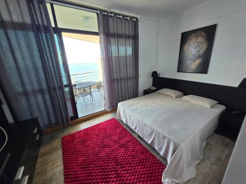 En eller flere senge i et værelse på Tropical VIsão da Ponta Negra