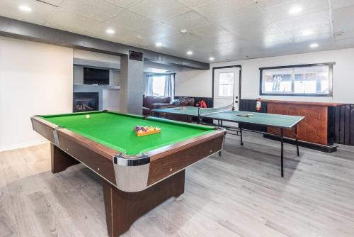 a room with two pool tables in a room at Covington Close in Calgary