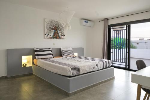 Giường trong phòng chung tại Villa Kër Girafes 3 bedrooms, 3 double beds, Somone