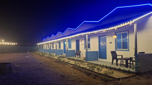 a house with lights on the side of it at night at Mystic Resort Dublagadi in Balasore