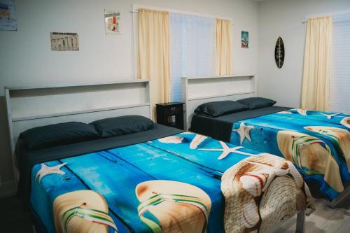 Postel nebo postele na pokoji v ubytování The Board House Shortboard