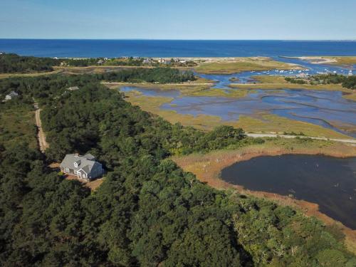 an aerial view of a house on the shore of a river at Beautiful Water Views Dogs Welcome in Truro