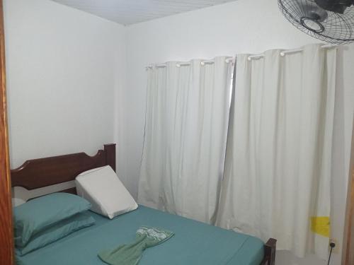 En eller flere senge i et værelse på Casa no Bosque Felizcidade