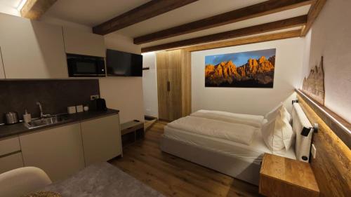 En eller flere senge i et værelse på Il Laricino