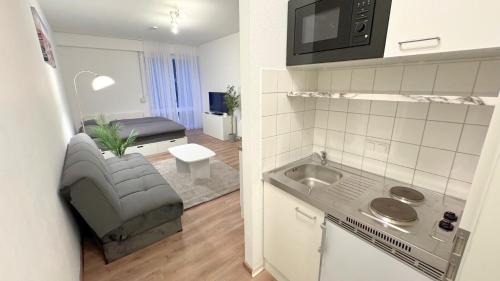 Kuchyň nebo kuchyňský kout v ubytování Modern, quiet apartment right by S-Bahn - close to Munich & airport