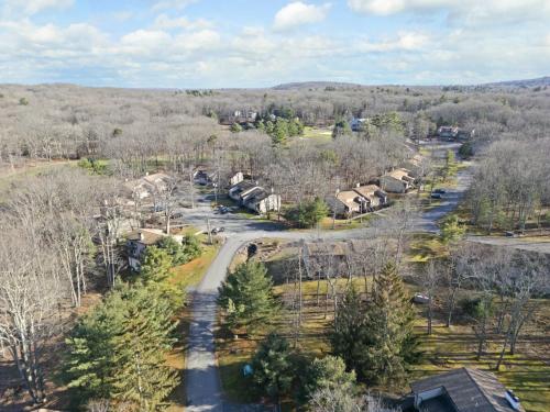 an aerial view of a village with trees and houses at Westwood Villas by Coolvacay in Lake Harmony