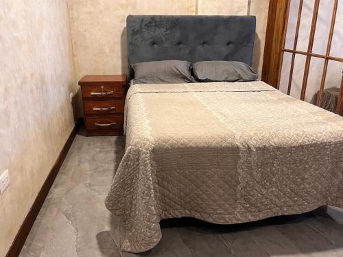 A bed or beds in a room at Edificio Suites los Laureles