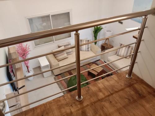 En eller flere senge i et værelse på Front beach cosy apartment