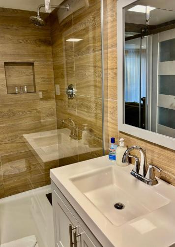 a bathroom with a sink and a shower at Cape Cod Veranda in South Yarmouth