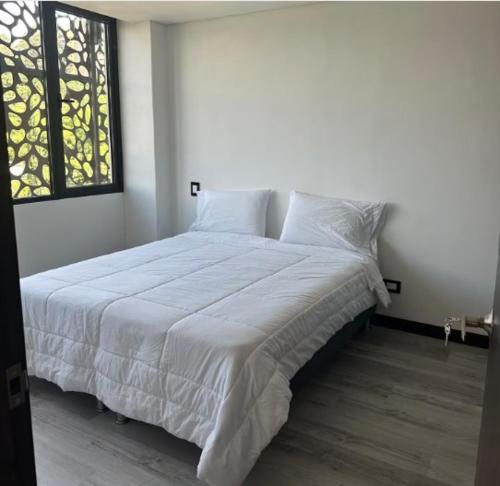 Ένα ή περισσότερα κρεβάτια σε δωμάτιο στο 101 Poblado apartamento