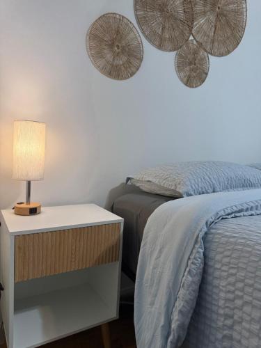 a bedroom with a bed and two umbrellas on the wall at Oasis Retreat - Cozy studio in Union Square in New York