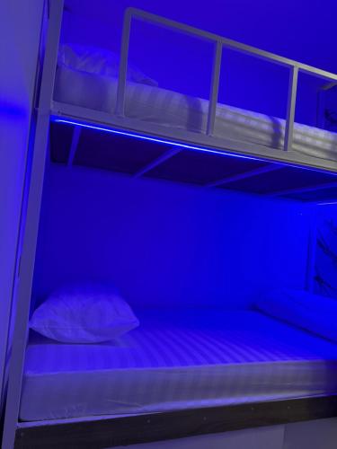 Ένα ή περισσότερα κρεβάτια σε δωμάτιο στο Best Inn Hostel Patong