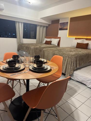 Ένα ή περισσότερα κρεβάτια σε δωμάτιο στο Seu cantinho no Centro do Recife