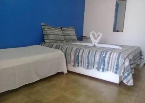 Postel nebo postele na pokoji v ubytování Pousada Simples Aconchego