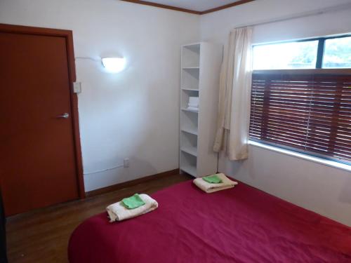 Ένα ή περισσότερα κρεβάτια σε δωμάτιο στο Dragon's den