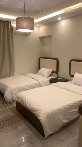 Postel nebo postele na pokoji v ubytování Z m Happy hause hotel