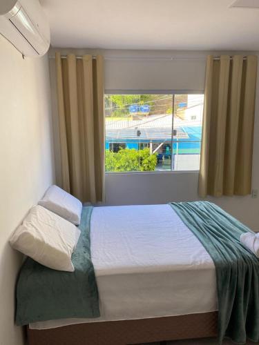 Postel nebo postele na pokoji v ubytování Suítes Central