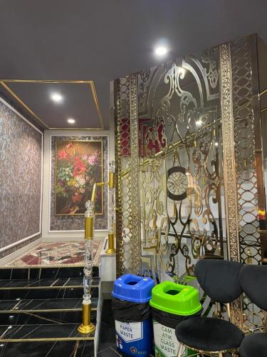 a room with a table and some chairs and a wall at Golden Lux Hotel Antalya in Antalya