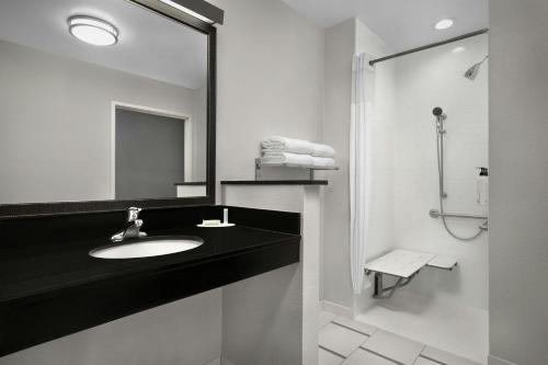 a bathroom with a sink and a mirror at Fairfield Inn & Suites by Marriott Jeffersonville I-71 in Jeffersonville
