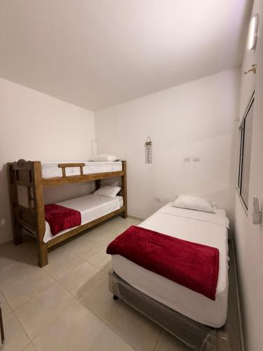 a room with two bunk beds in it at Apartamento completo in Santa Marta