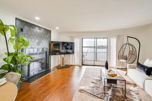 a living room with a couch and a fireplace at Sunset-View Resort Condo on Lake Hamilton! in Hot Springs