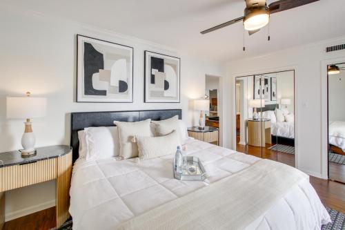 a bedroom with a large bed with a tray on it at Sunset-View Resort Condo on Lake Hamilton! in Hot Springs