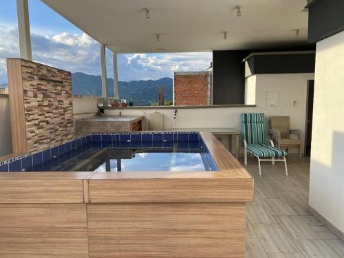 a house with a swimming pool on a roof at Spa house with private Jacuzzi in Dosquebradas - Pereira in Dosquebradas