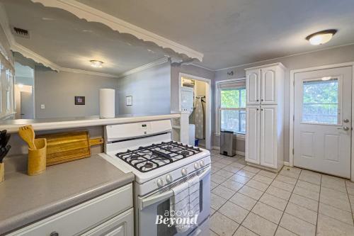 a kitchen with a stove top oven in a room at The Updated Aviator - Minutes to Everything Wichita Falls, TX in Wichita Falls