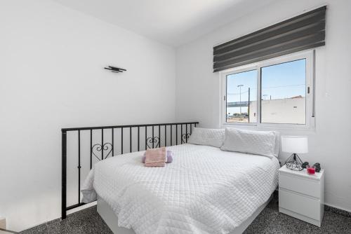 Giường trong phòng chung tại Dúplex El Chaparral Golf