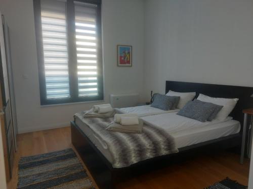 Ένα ή περισσότερα κρεβάτια σε δωμάτιο στο Kilenc Danube District 11