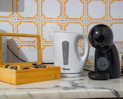 Příslušenství pro přípravu čaje a kávy v ubytování I Cuculi vacation home in Lucca