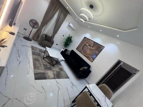 Una televisión o centro de entretenimiento en Elite Suite - 1 Bed