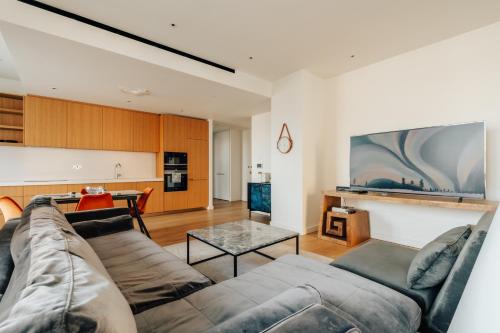 a living room with a couch and a table at LUXURY 3 Bed 3 Bath Apartment in Central London in London