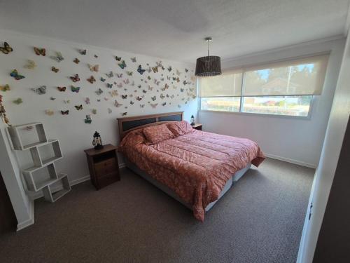 Giường trong phòng chung tại Departamento full equipado en Parque Mar El Tabo