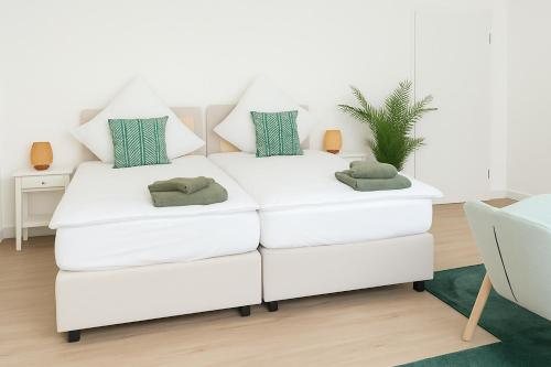 Ένα ή περισσότερα κρεβάτια σε δωμάτιο στο Top-Lage ideal für Teams & Familien mit 6 Personen