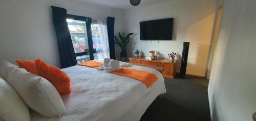 Ένα ή περισσότερα κρεβάτια σε δωμάτιο στο Cozy-in Rotorua