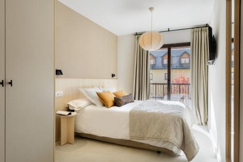 Ένα ή περισσότερα κρεβάτια σε δωμάτιο στο Cima Panticosa by BeValle