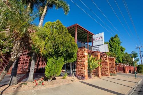 a brick building with a sign for a hotel at Elkira Court Motel in Alice Springs