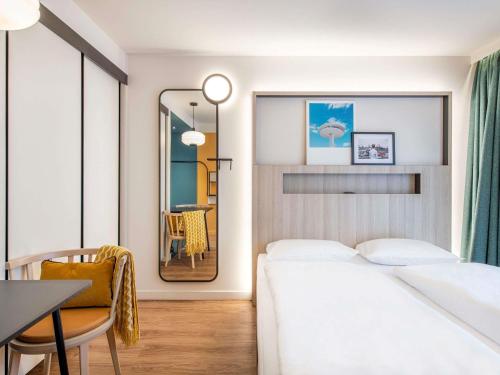 Ένα ή περισσότερα κρεβάτια σε δωμάτιο στο Aparthotel Adagio access Hamburg