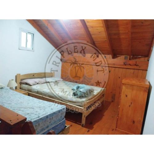 Ένα ή περισσότερα κρεβάτια σε δωμάτιο στο TRIPLEX MDT a 200mt de la playa 8 personas