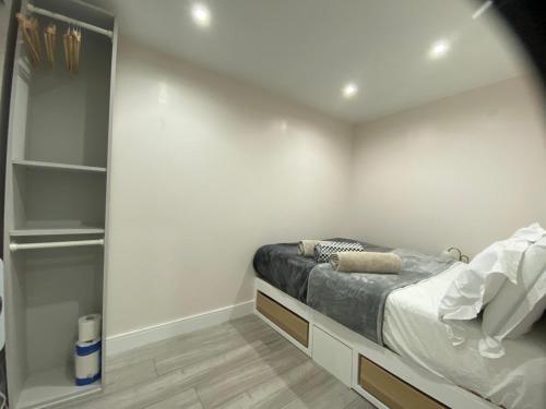 A bed or beds in a room at Moore Place