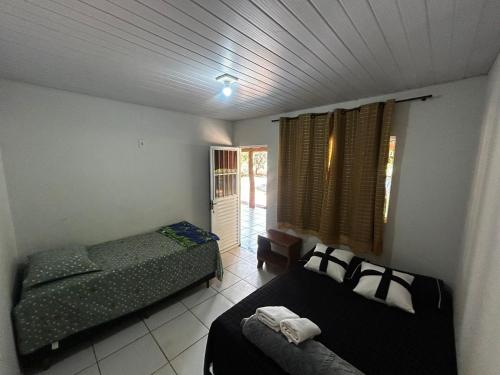 Ένα ή περισσότερα κρεβάτια σε δωμάτιο στο Pousada São Martins