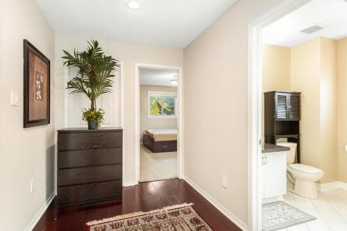 a hallway of a home with a room with a bedroom at Spacious 5BR Retreat with Private Suite Sleeps 12 in Mississauga