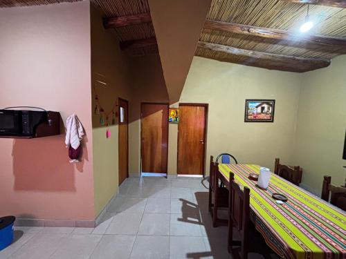 a dining room with a table and chairs at Alojamiento Tati in Purmamarca