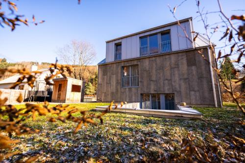 a house on a hill with a yard at Ubytování za Řekou in Hořejší Vrchlabí