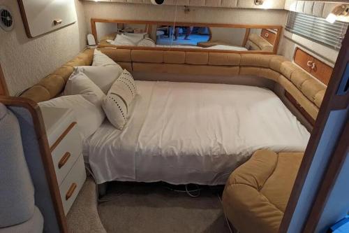 a small room with two beds and a couch at Luxury Yacht Stay in Port Antonio, Exclusive Dockside Escape in Port Antonio