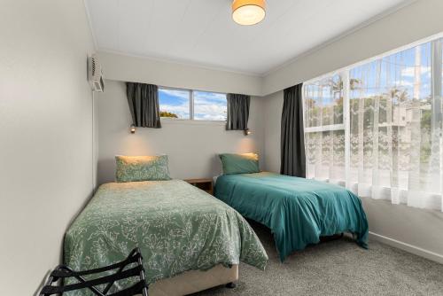 Ένα ή περισσότερα κρεβάτια σε δωμάτιο στο Amanda Lane - Snells Beach Holiday Home
