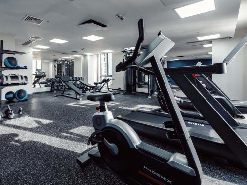 a gym with tread machines and a treadmill at ibis Tbilisi City in Tbilisi City