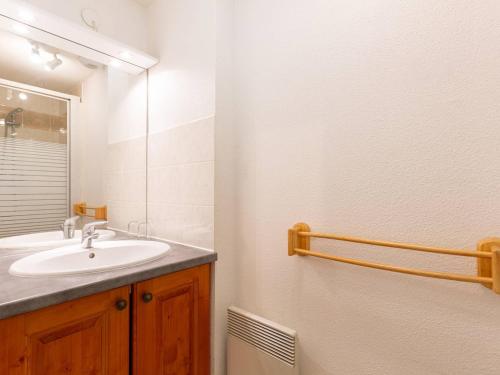a bathroom with a sink and a mirror at Appartement 6 pers. à Loudenvielle avec Wifi, proche Skyvall - FR-1-695-93 in Loudenvielle